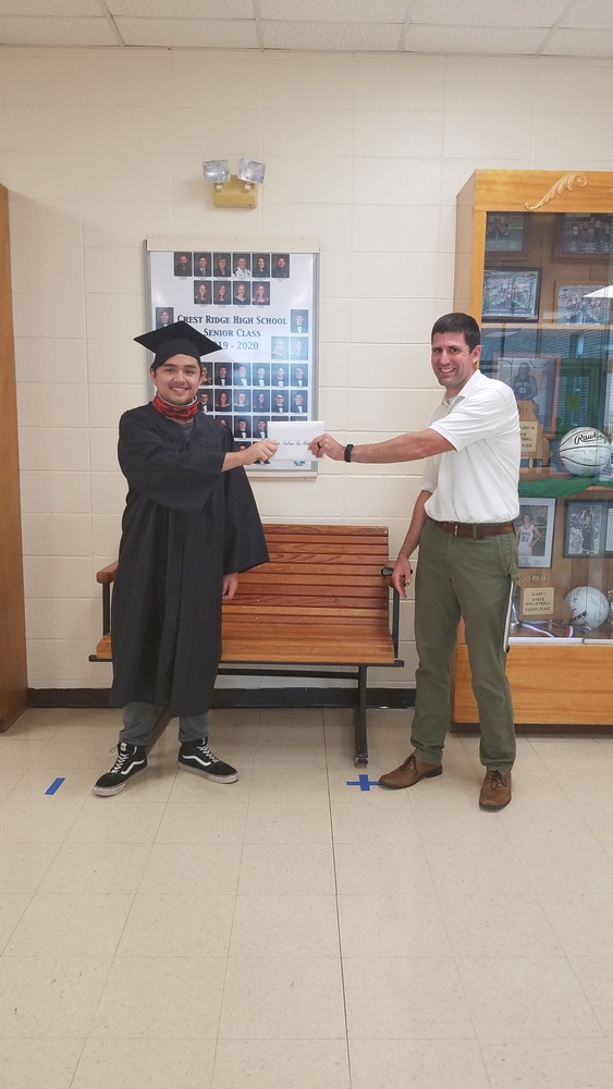 2020 Graduate Jason Badua receives his diploma from Mr. Frank.