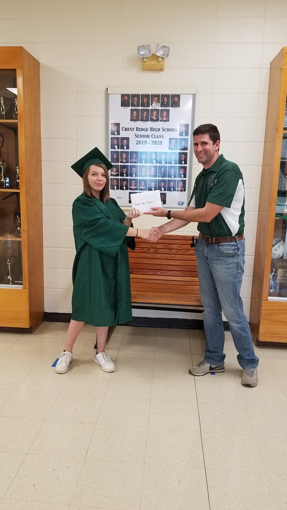 Rachel Rogers receives diploma from Mr. Frank